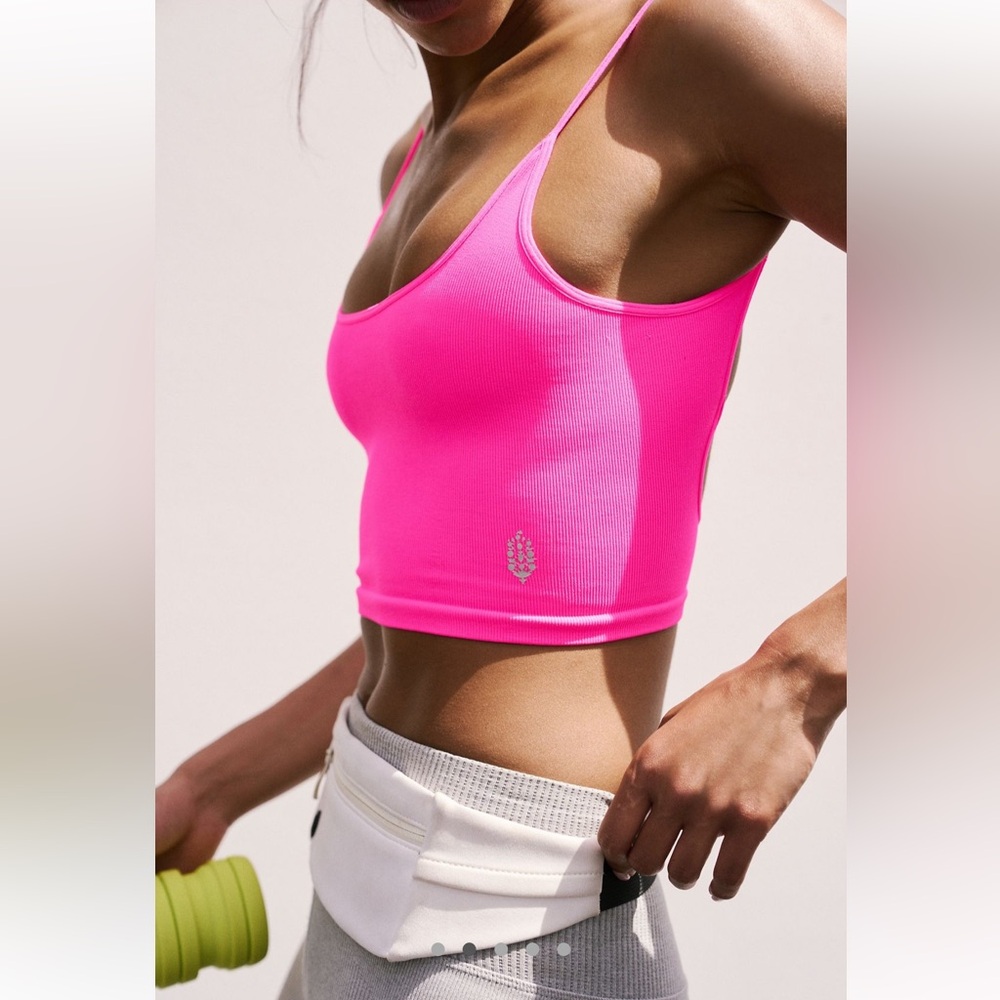 FREE PEOPLE tighten up tank in bright pink.